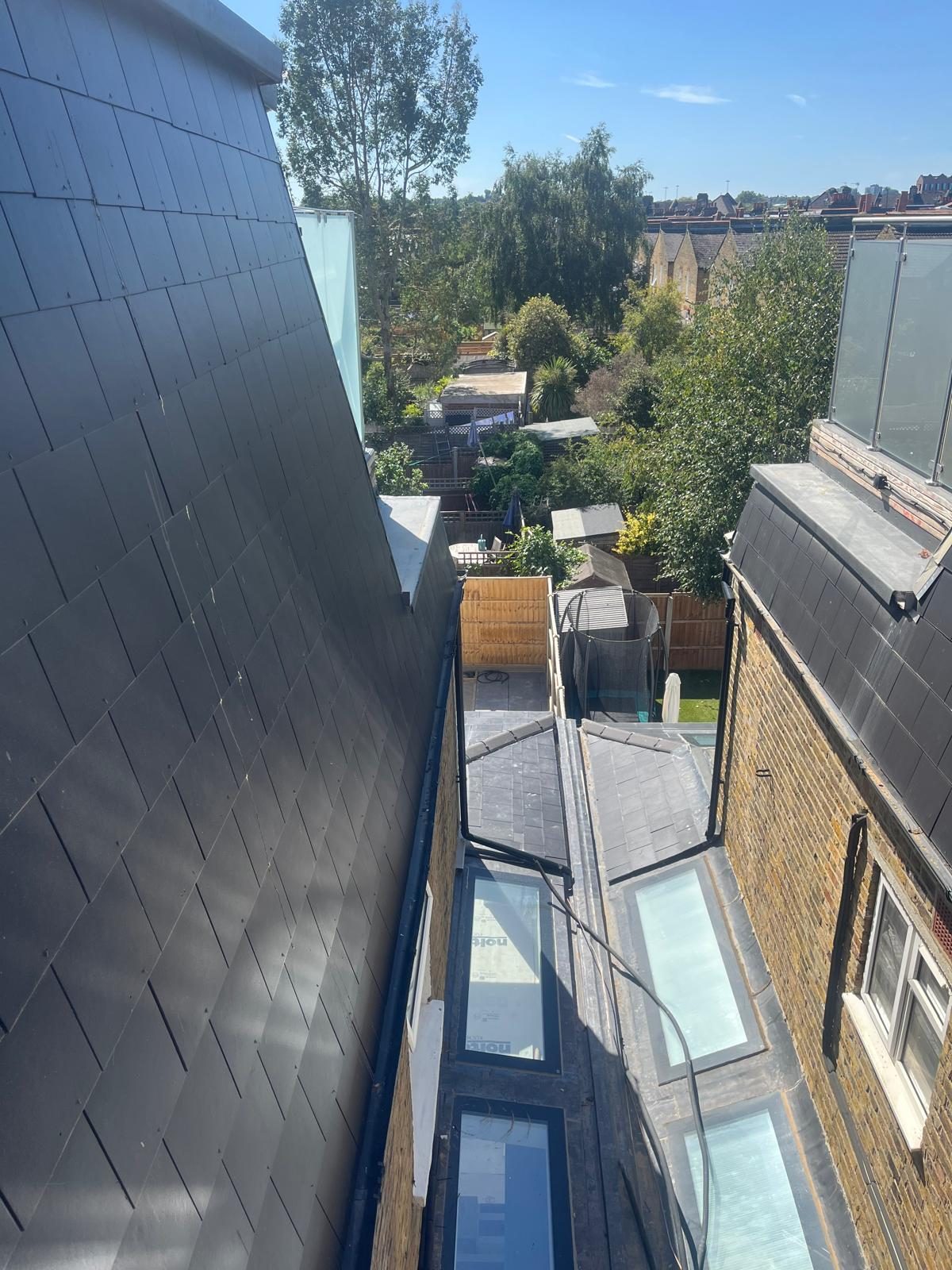 Structural roof glazing and rooflights between slate roofs